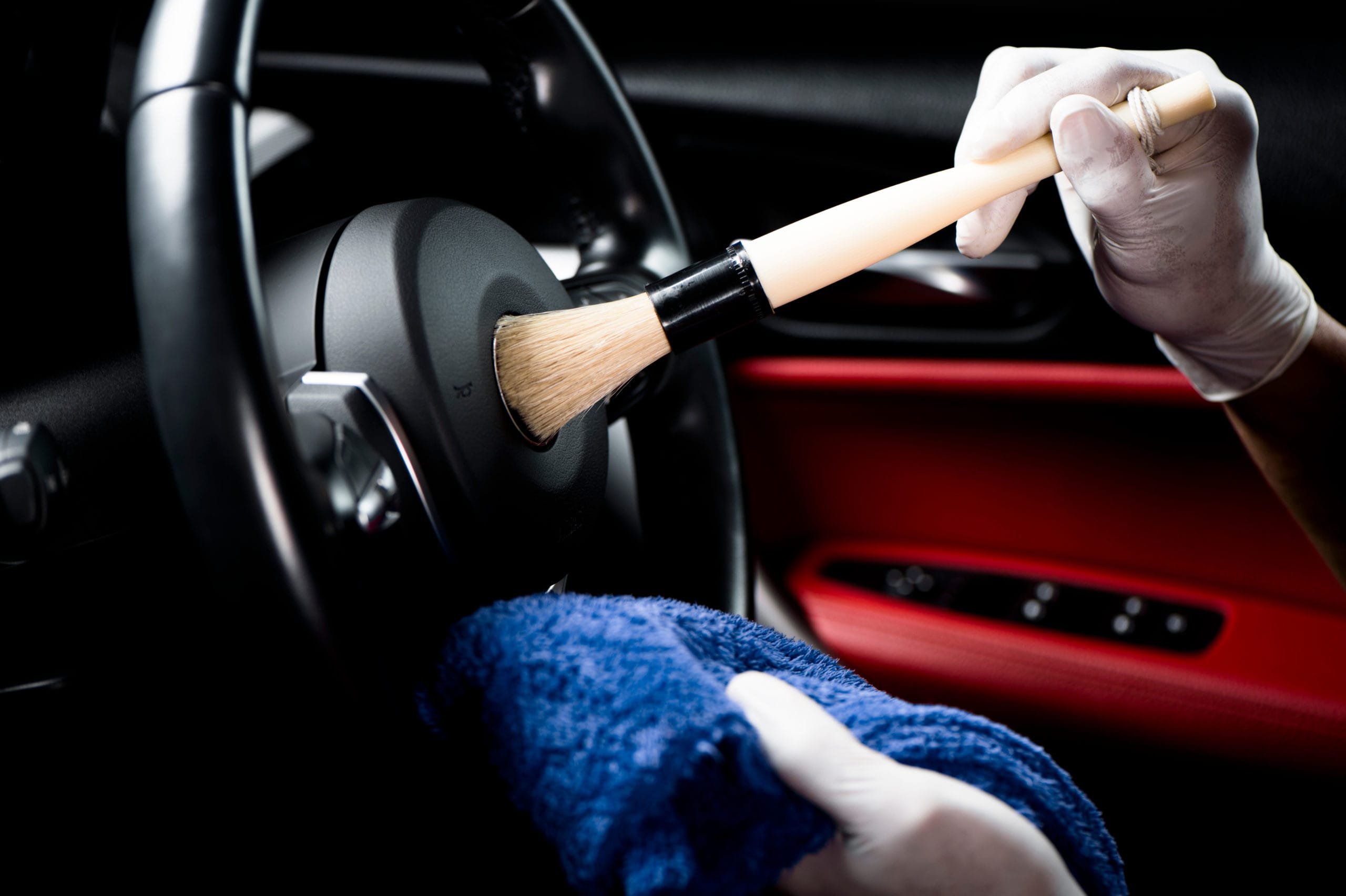 Car,Detailing,Series,,Man,Use,Brush,Cleaning,On,Hand,Wheel.